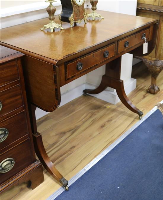 A Regency mahogany and coromandel banded sofa table W.94cm